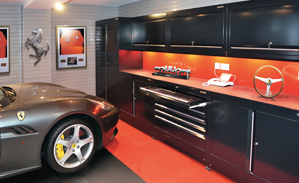 Themed garage with Dura cabinets and flooring for Ferrari owner