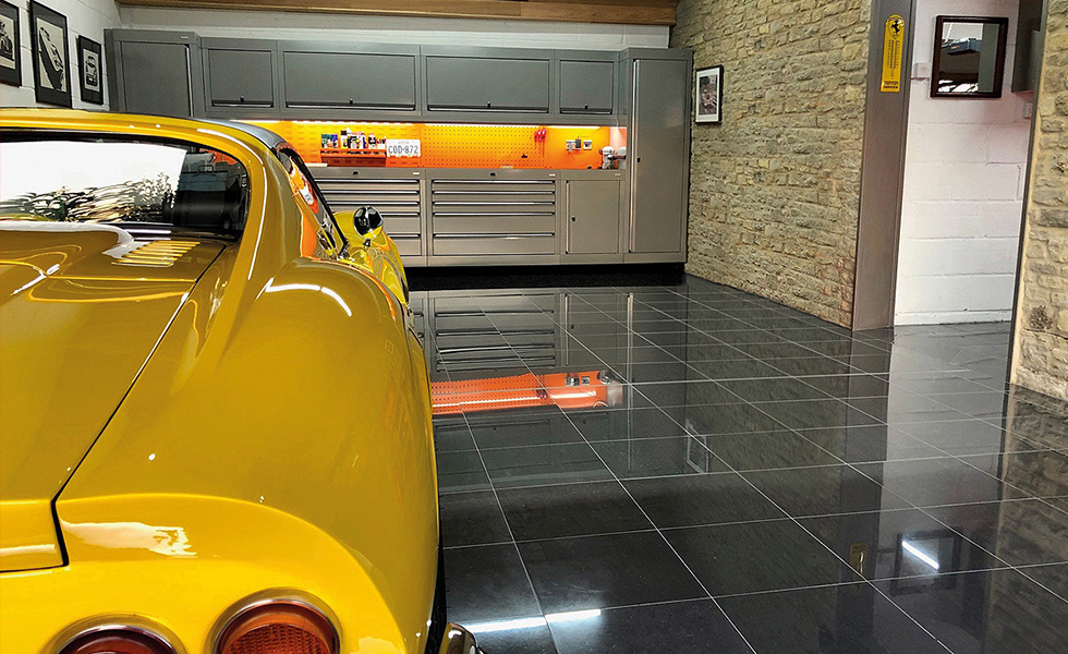 Stone built garage with Dura cabinets for Ferrari Dino owner