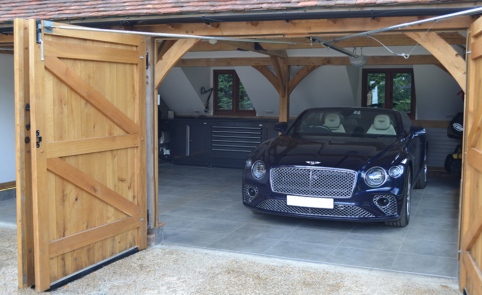 Timber frame garage with Dura cabinets for Bentley owner